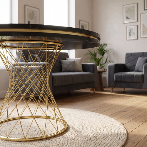 Capri dining table base detail — single central gold wire pedestal under the round black marble-effect top
