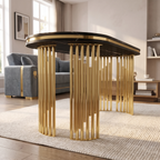 Prague table base detail — two free-standing clusters of upright gold pipes, piano-foot design