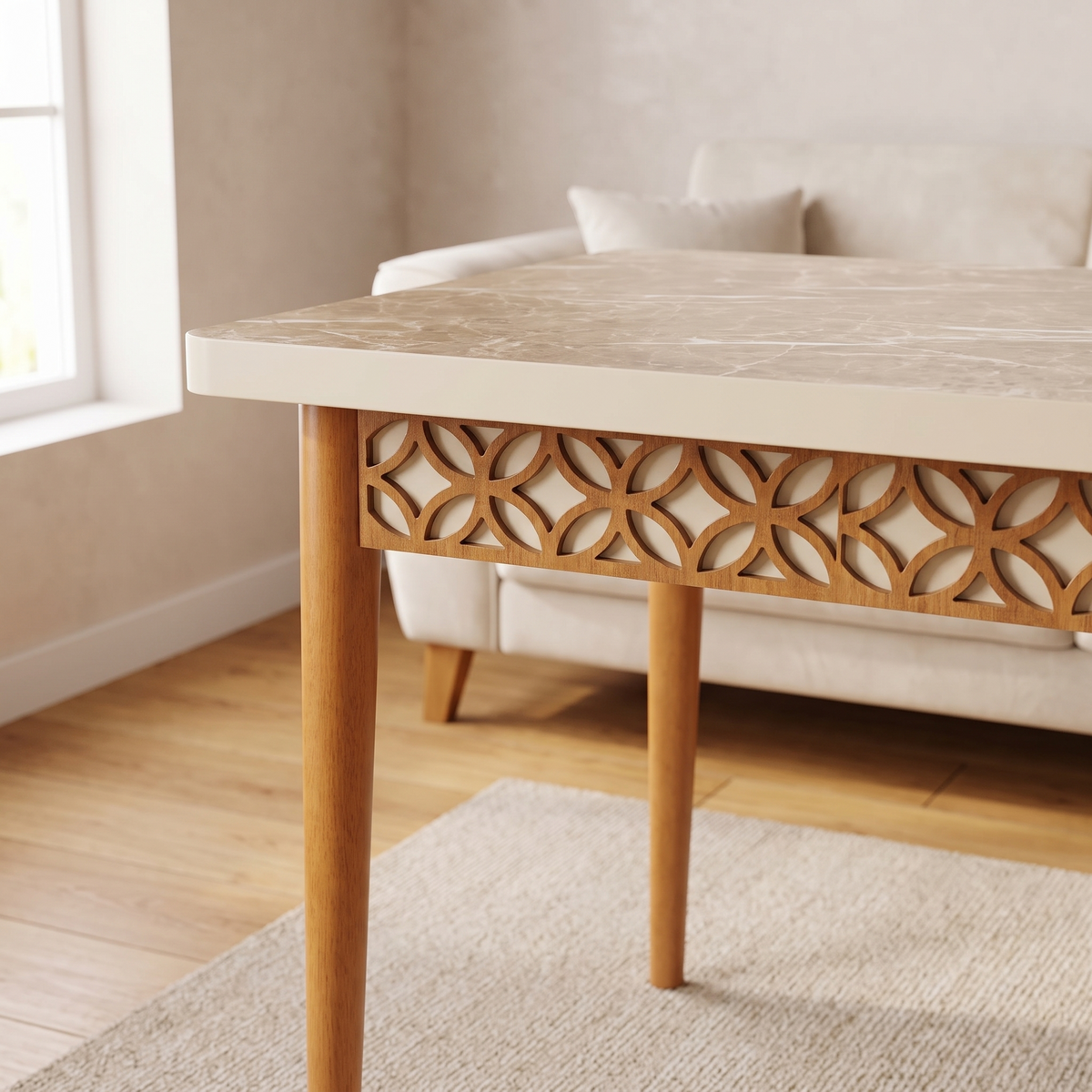 Lisbon table detail — the carved wooden lattice apron of interlocking circles beneath the marble-effect top, and a tapered wooden leg