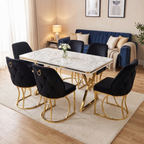 Stockholm dining set in a warm family living-dining room — white marble-effect top on gold V-frames with six black velvet chairs, Florence deep blue sofa behind