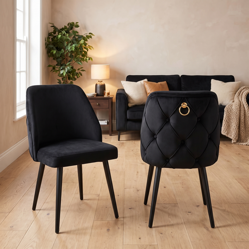 Black velvet dining chair with scalloped buttoning and a gold ring pull on tapered black legs — Istanbul